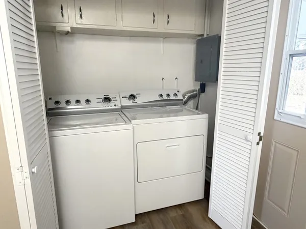 a utility room with dryer and washer