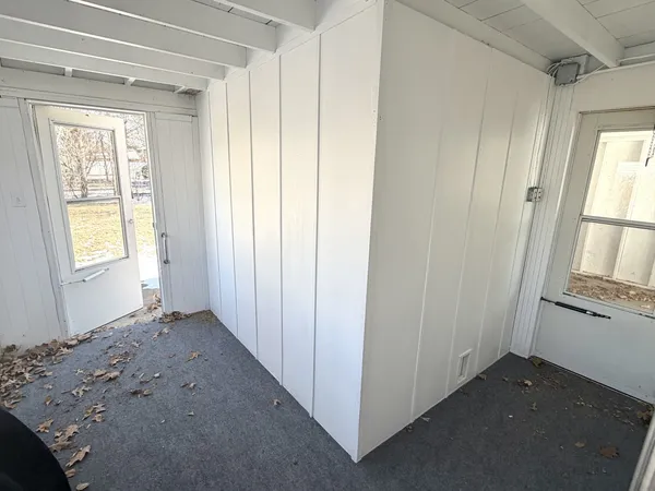 an empty room with windows