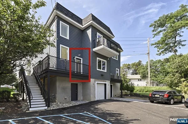 a front view of a house with parking