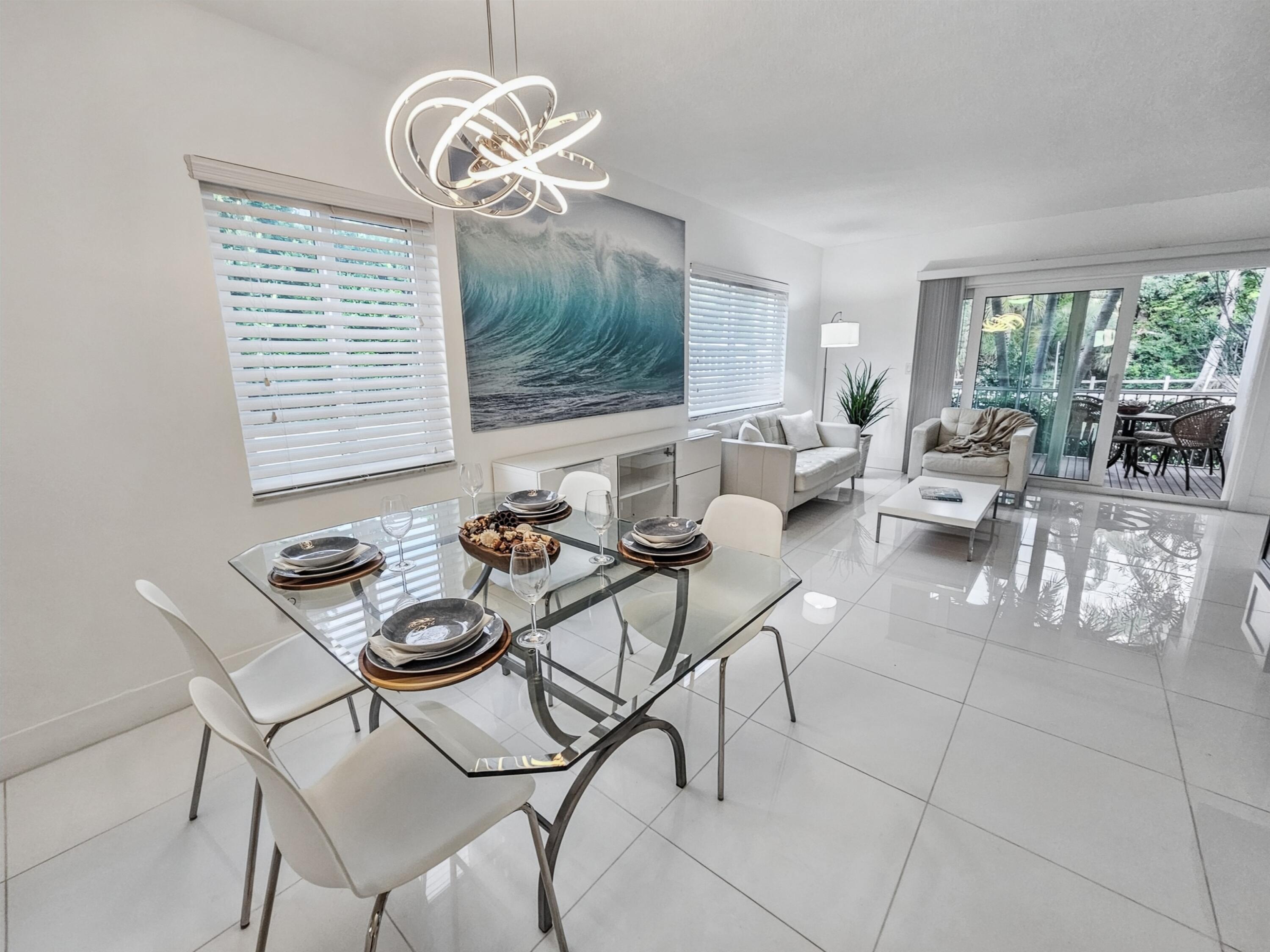 6530 North Ocean Boulevard, Unit 1080 Ocean Ridge, FL 33435 - Photo 12 of 54 a living room with furniture and a large window