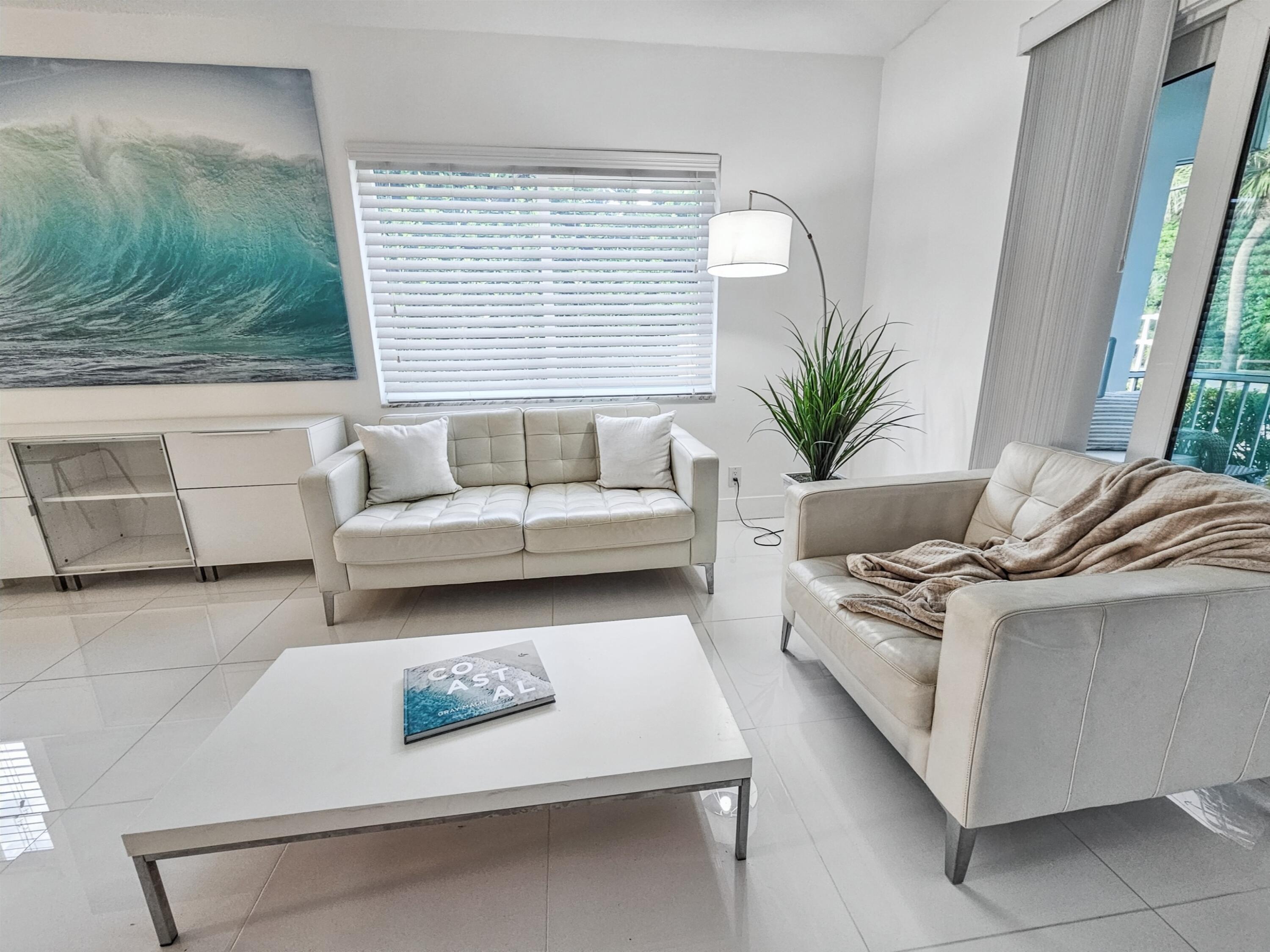 6530 North Ocean Boulevard, Unit 1080 Ocean Ridge, FL 33435 - Photo 15 of 54 a living room with furniture and a large window