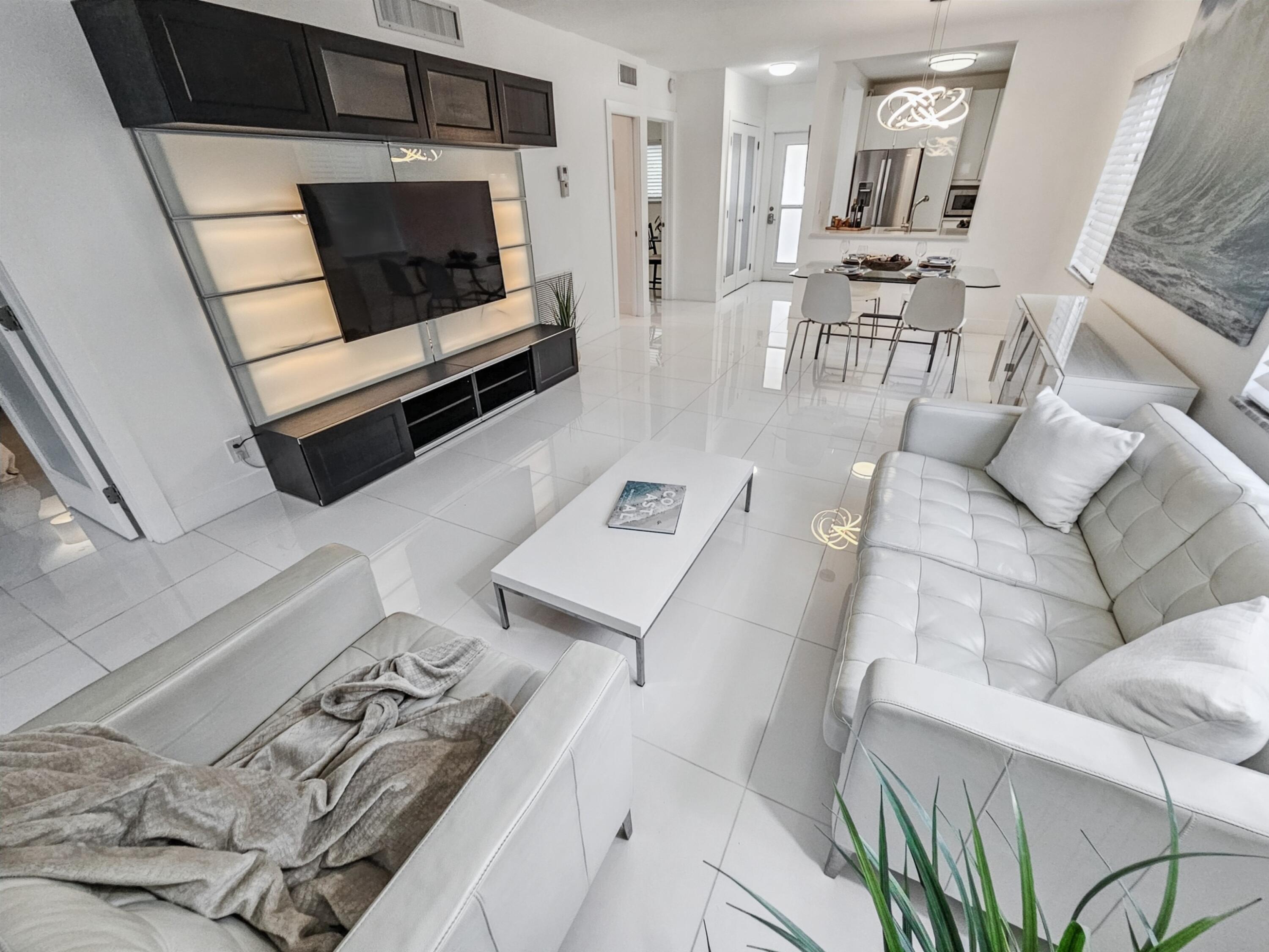 6530 North Ocean Boulevard, Unit 1080 Ocean Ridge, FL 33435 - Photo 17 of 54 a living room with furniture and a fireplace