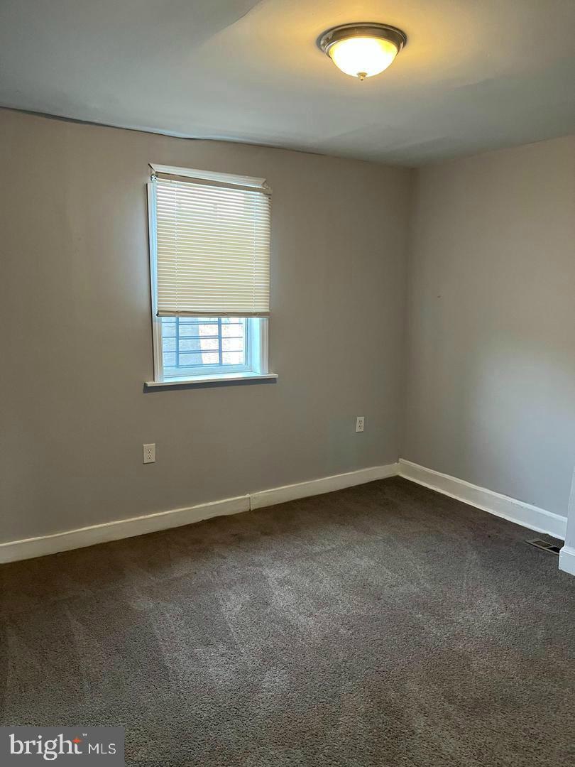 1904 Mosher Street Baltimore, MD 21217 - Photo 11 of 16 an empty room with a window