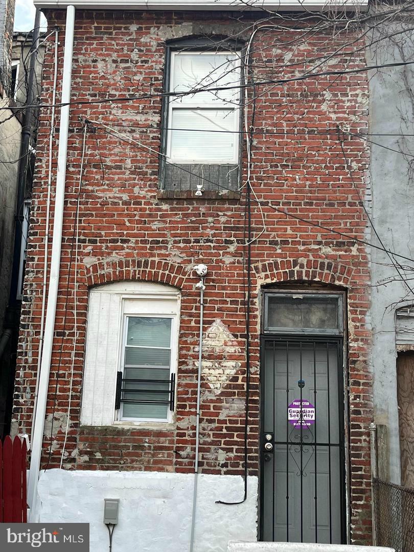 1904 Mosher Street Baltimore, MD 21217 - Photo 15 of 16 a brick house with a door