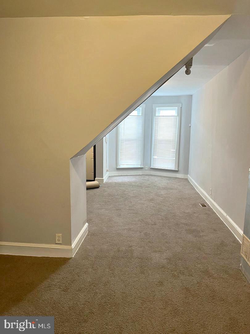 1904 Mosher Street Baltimore, MD 21217 - Photo 3 of 16 a view of an empty room with windows