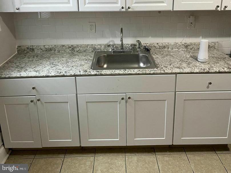 1904 Mosher Street Baltimore, MD 21217 - Photo 5 of 16 a kitchen with a sink and cabinets