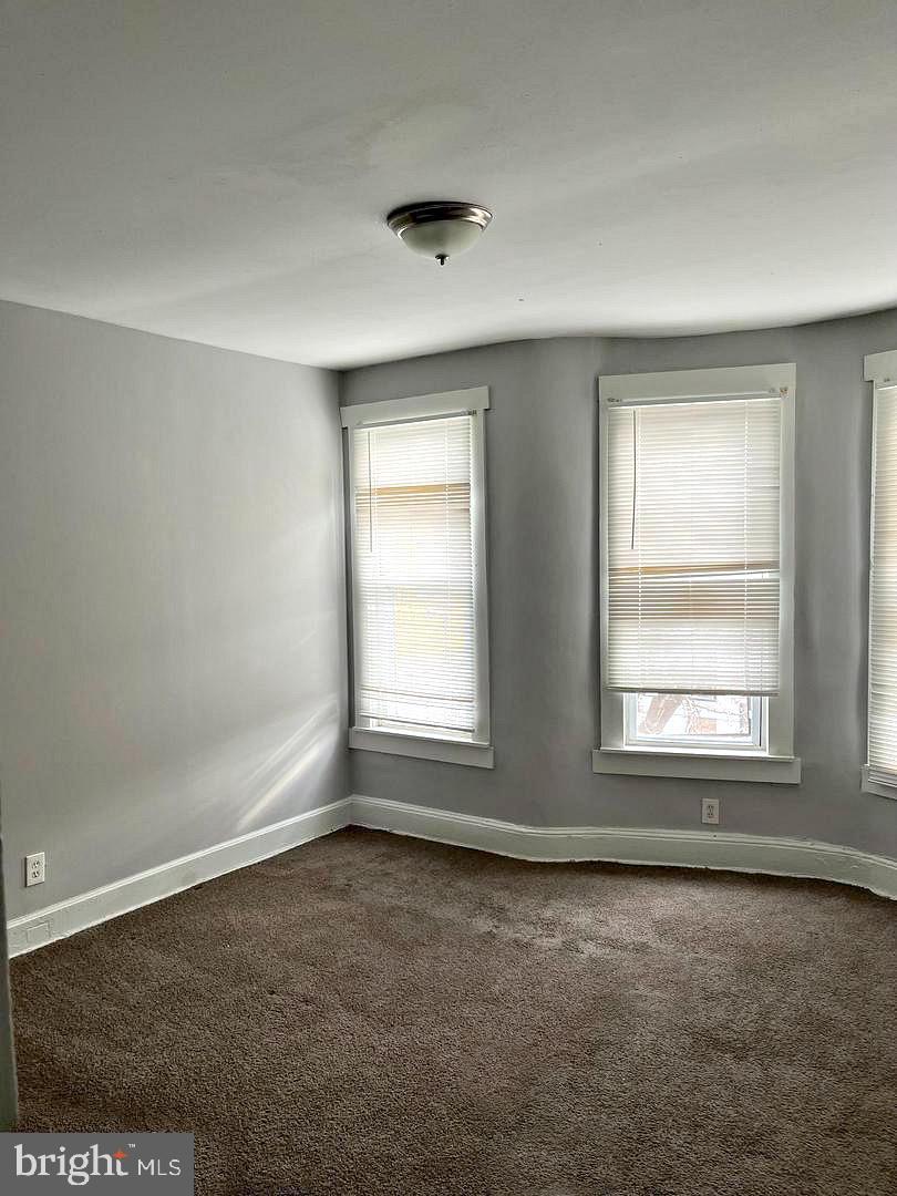 1904 Mosher Street Baltimore, MD 21217 - Photo 9 of 16 an empty room with a window