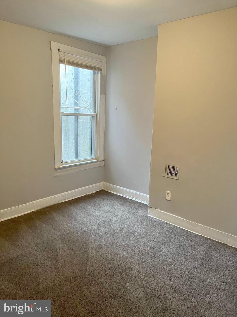 1904 Mosher Street Baltimore, MD 21217 - Photo 10 of 16 an empty room with a window