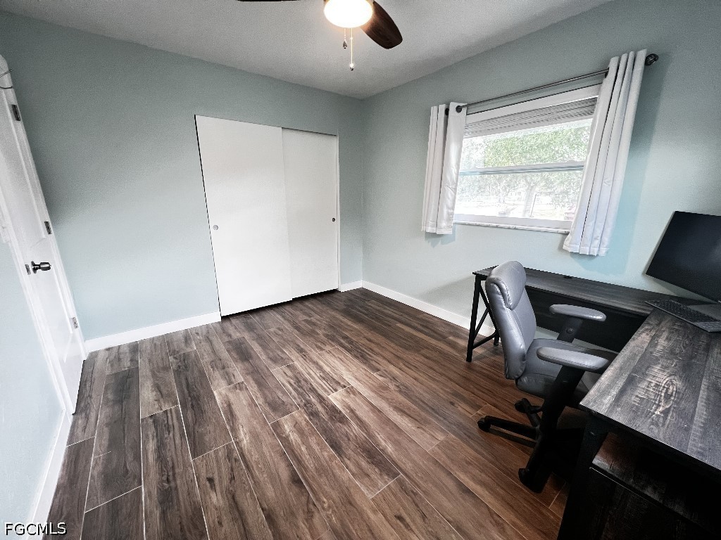 144 Whidden Road North Fort Myers, FL 33917 - Photo 10 of 16 a workspace with wooden floor and a window