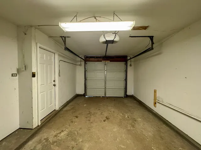 a view of kitchen and refrigerator