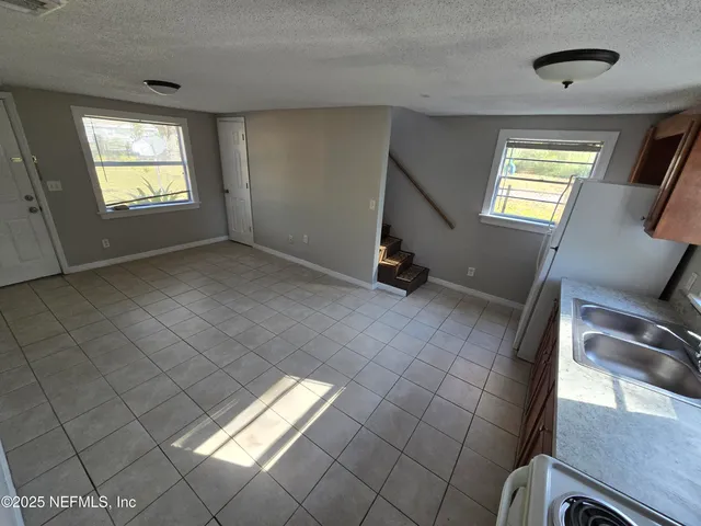 a view of empty room with windows