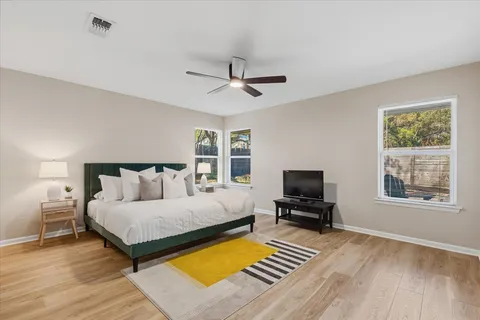 a bedroom with a bed and a television