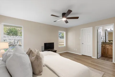 a bedroom with a large bed and a window