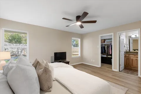 a bedroom with a large bed and a window