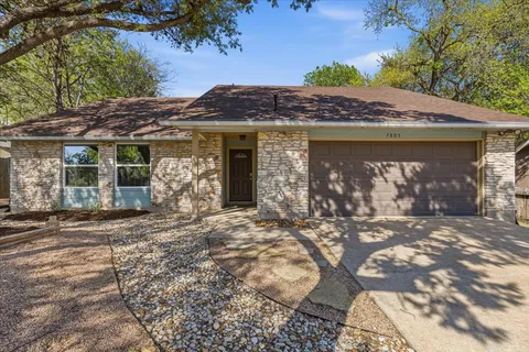 a view of a house with a tree