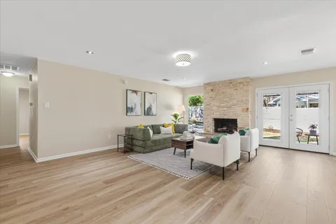 a living room with furniture and a fireplace