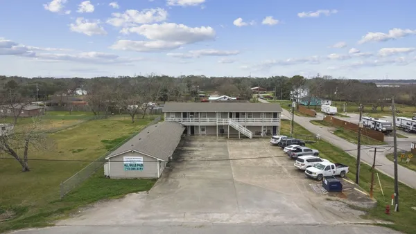 an aerial view of a house with a yard lake view and mountain view