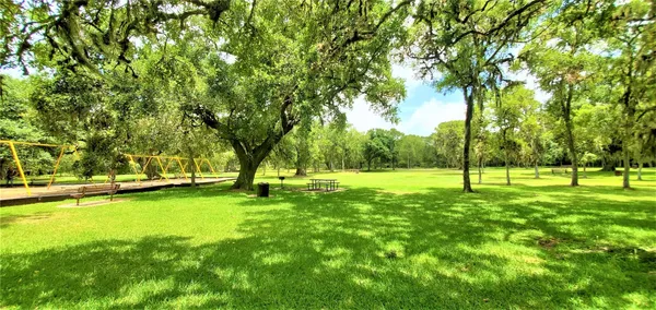 a view of a swimming pool with a bench