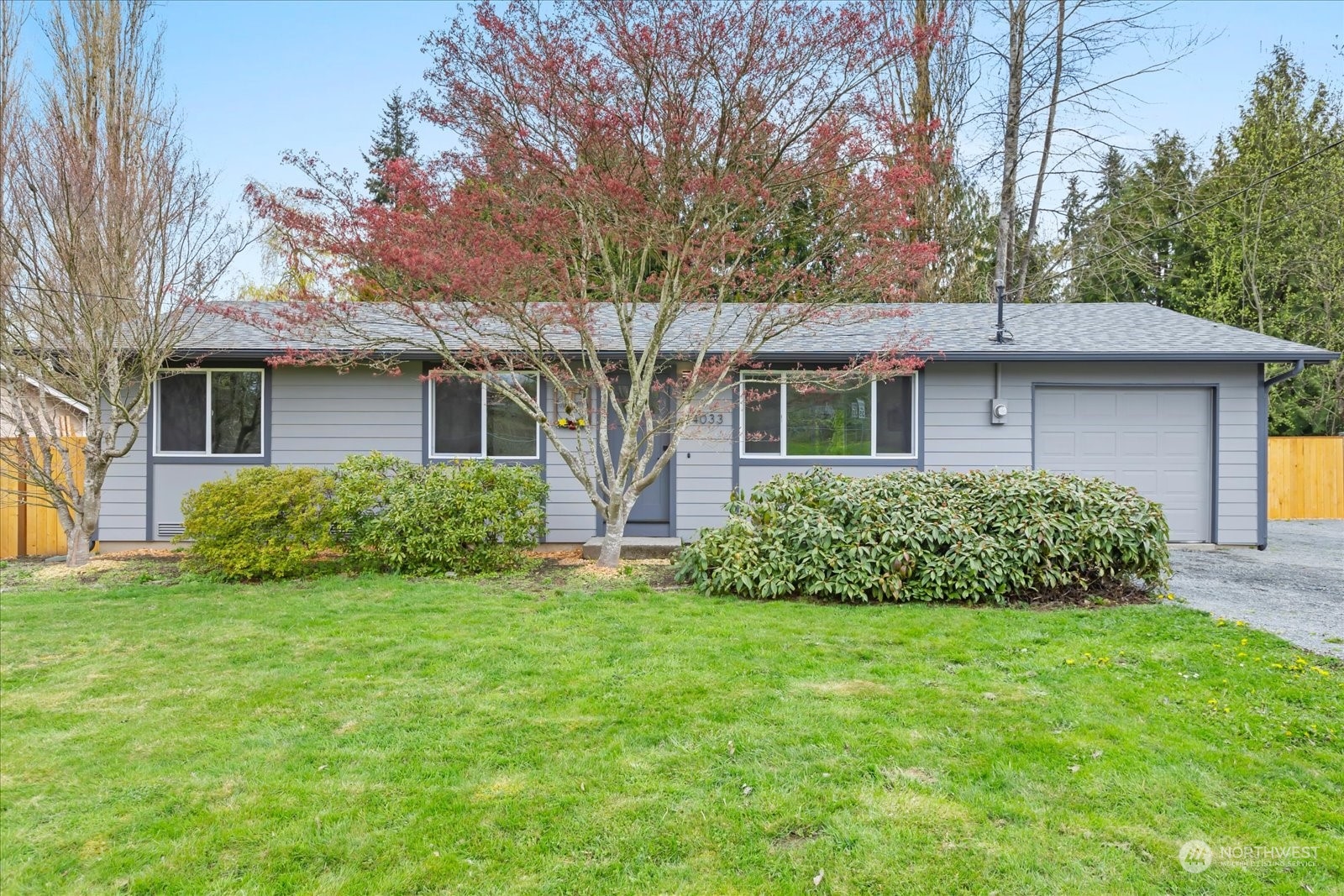 14033 Connelly Road Snohomish, WA 98296 - Photo 2 of 33 a front view of a house with a garden