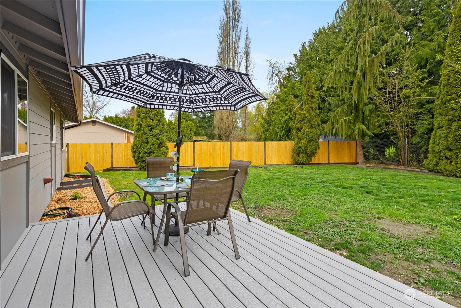 14033 Connelly Road Snohomish, WA 98296 - Photo 23 of 33 a view of a chair and table on the deck