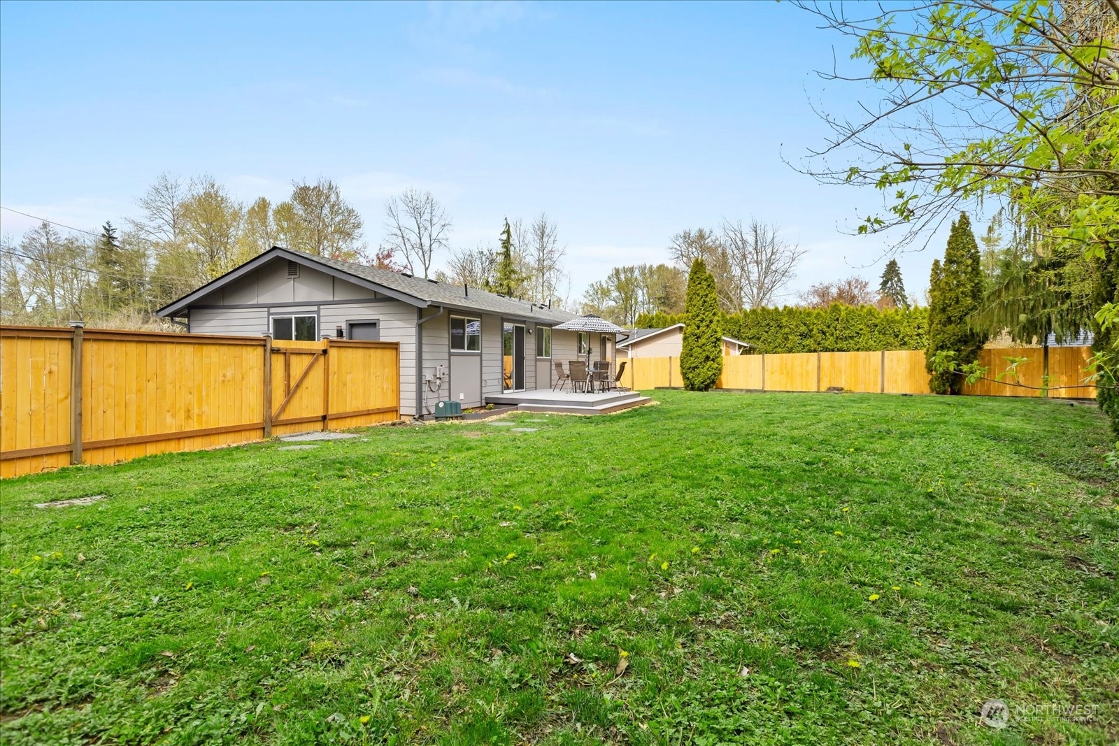 14033 Connelly Road Snohomish, WA 98296 - Photo 25 of 33 a view of a house with a big yard and large trees