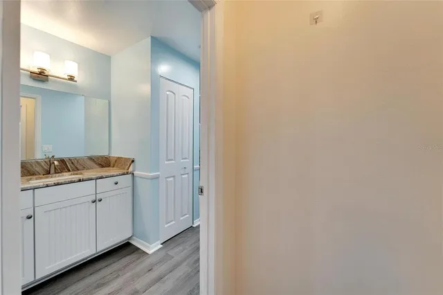 a bathroom with a toilet a sink and a window