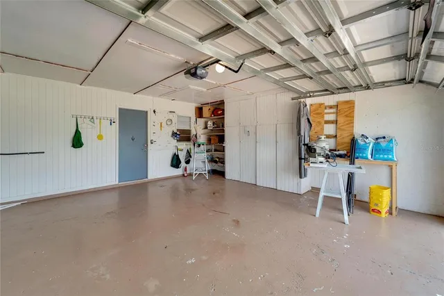 a view of a patio with table and chairs and potted plants