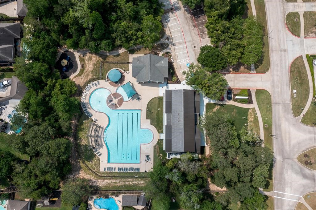 1215 Jake Springs Court Spring, TX 77386 - Photo 40 of 49 The neighborhood's Jr. Olympic-sized pool is perfect for laps or leisurely swims. Ample seating around the pool and a shallow area for little ones makes this a pool the whole family will love.