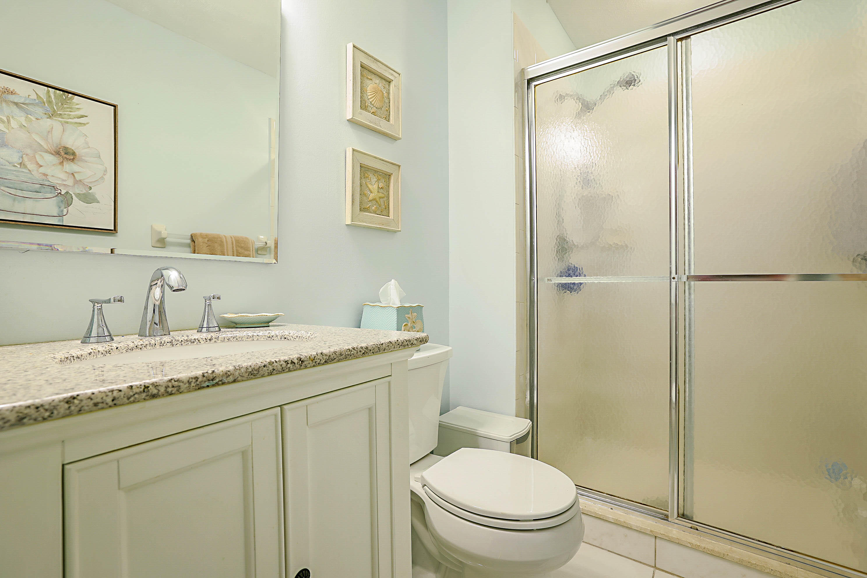 5231 Copperleaf Circle Delray Beach, FL 33484 - Photo 19 of 31 a bathroom with a granite countertop sink toilet and shower