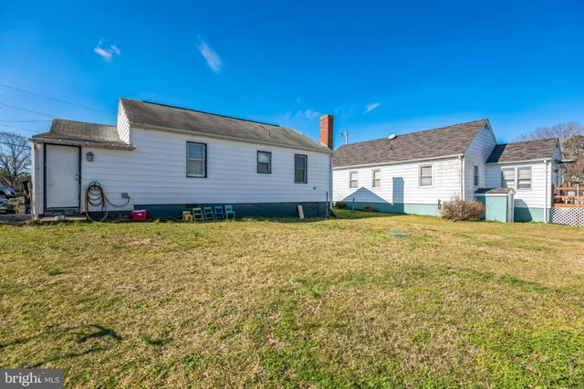 a house view with a backyard space
