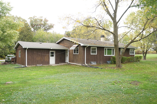 39-w257 McDonald Road St. Charles, IL 60175 - Photo 2 of 5 a view of a yard in front of a house with large trees