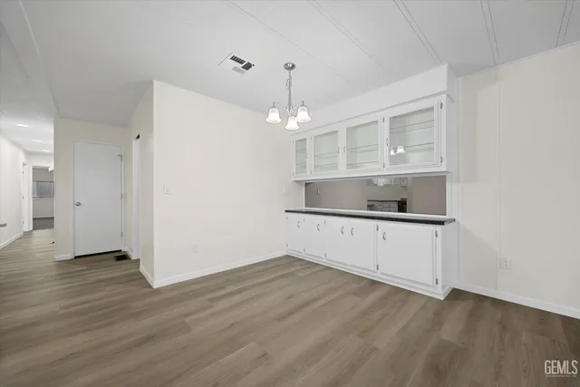 a kitchen with a refrigerator and a sink
