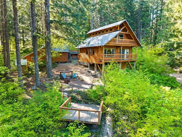 a aerial view of a house with a yard