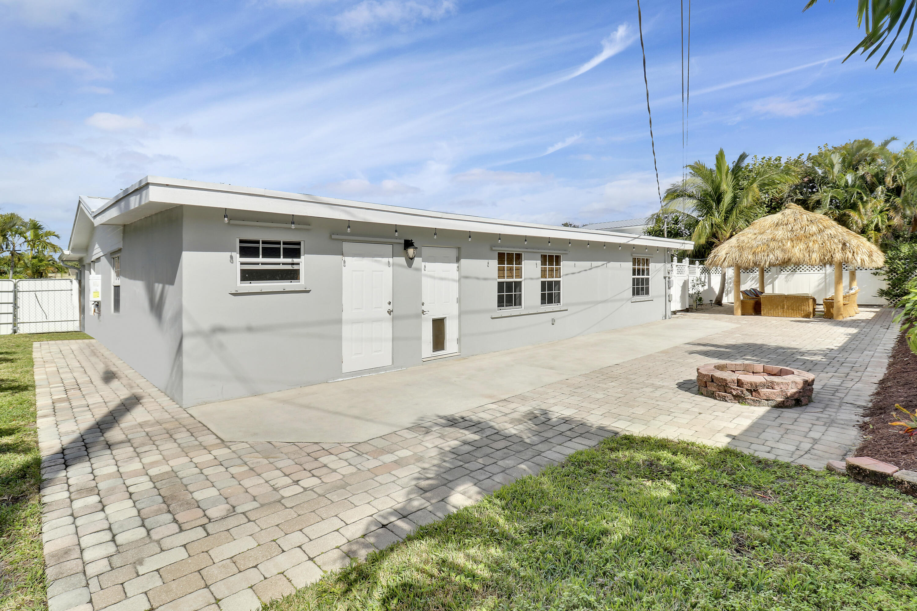 520 Inlet Road North Palm Beach, FL 33408 - Photo 14 of 51 a front view of a house with garden