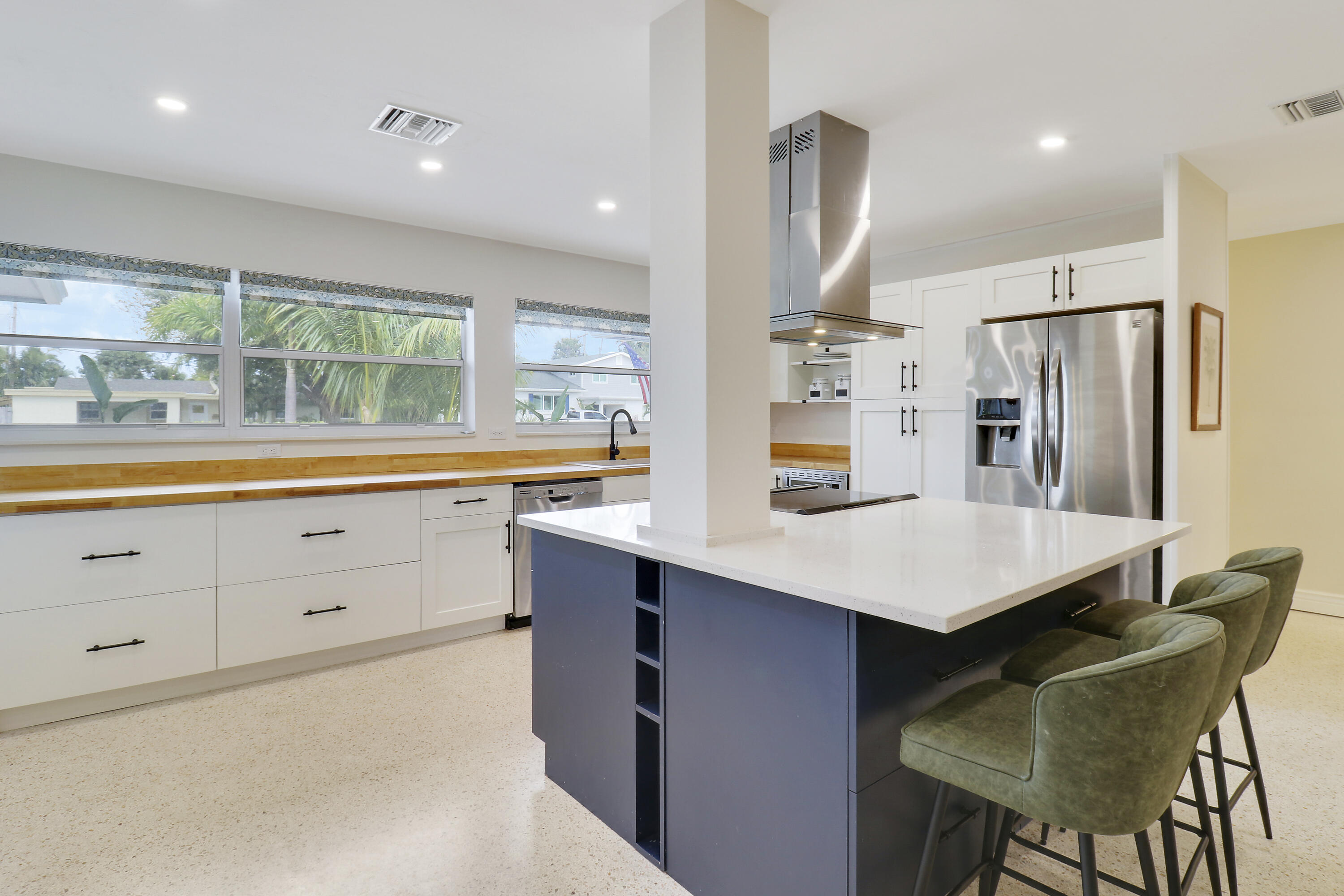 520 Inlet Road North Palm Beach, FL 33408 - Photo 27 of 51 a kitchen with white cabinets and window