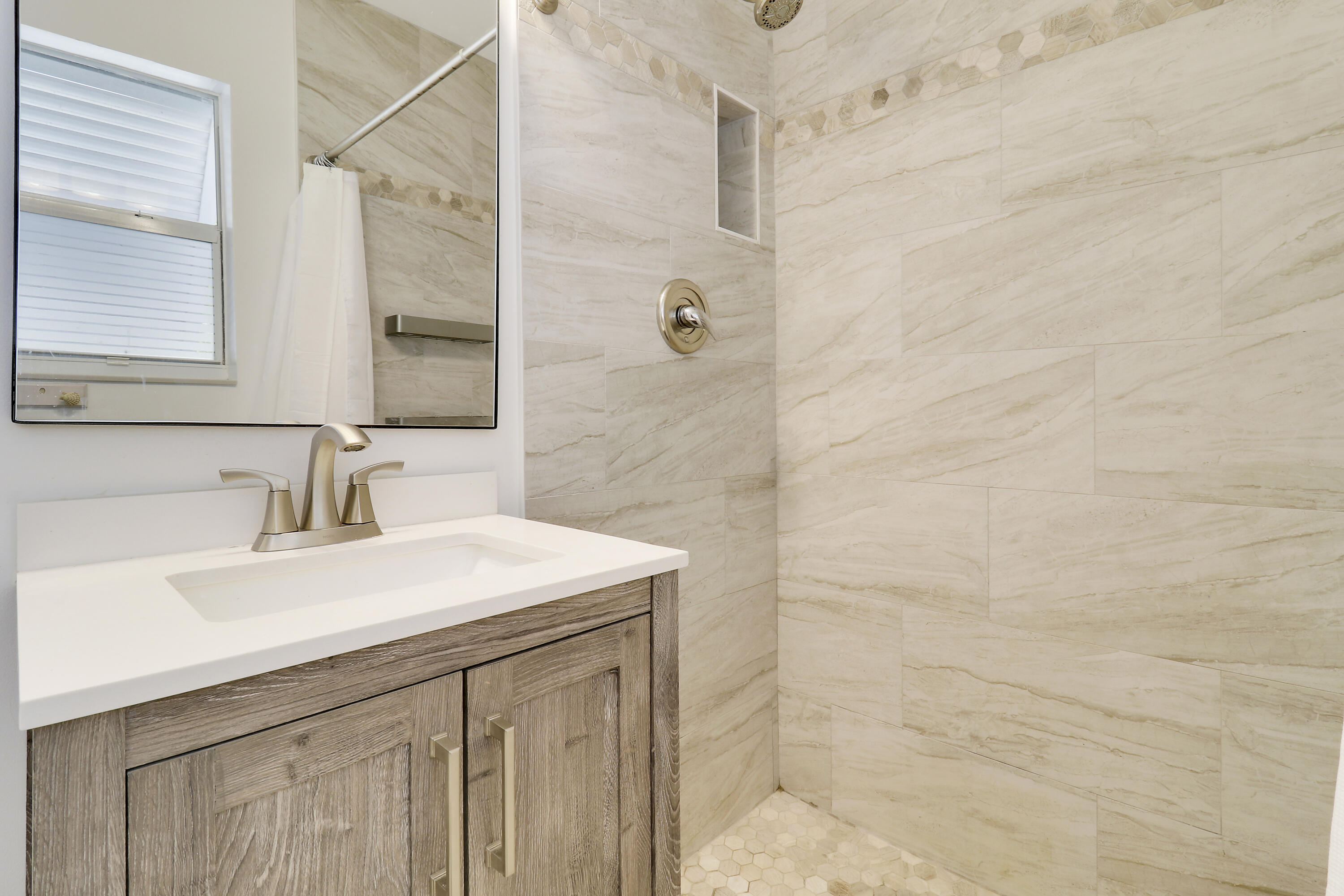 520 Inlet Road North Palm Beach, FL 33408 - Photo 30 of 51 a bathroom with a sink a vanity and a shower
