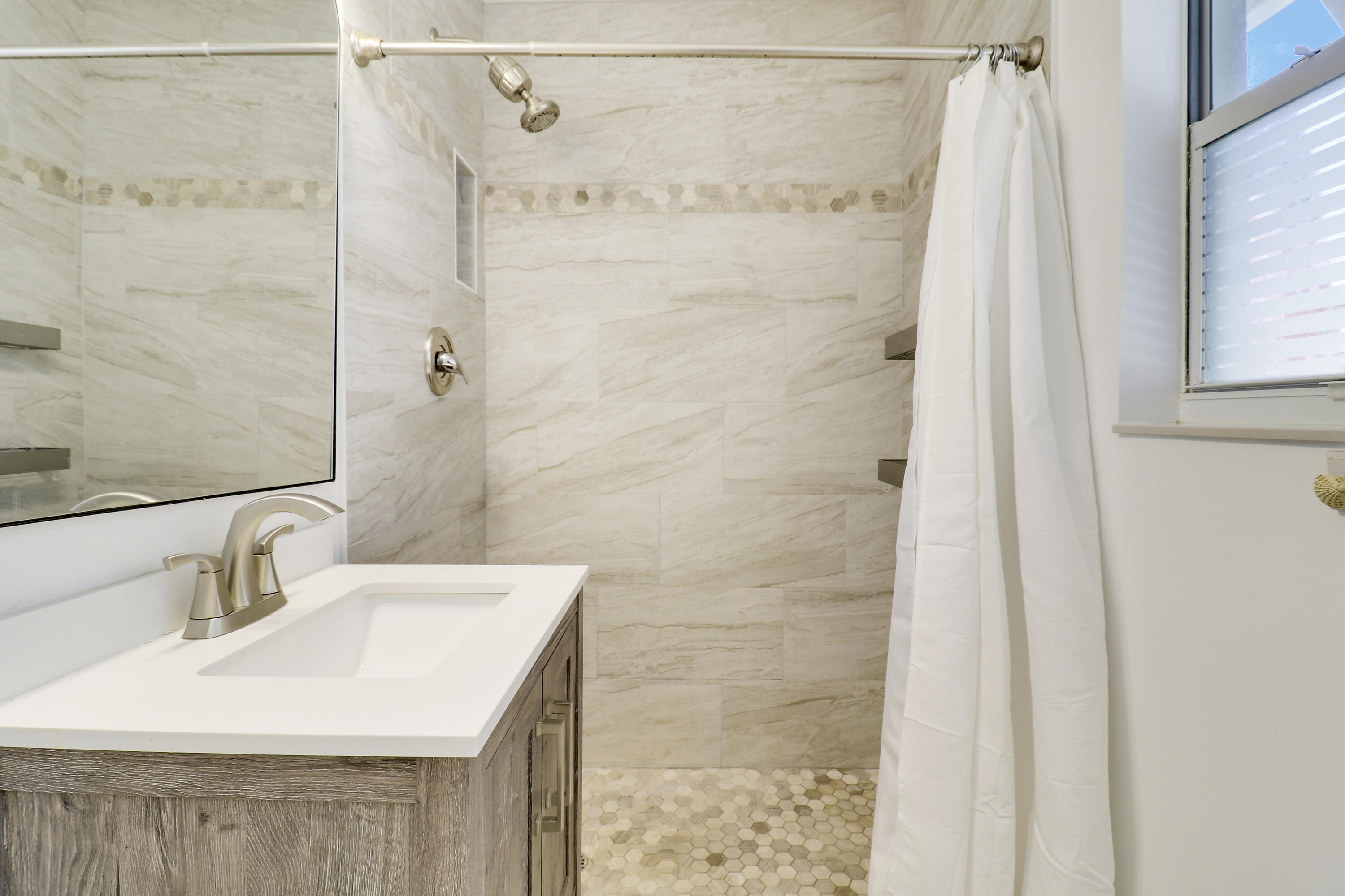 520 Inlet Road North Palm Beach, FL 33408 - Photo 31 of 51 a bathroom with a sink shower and a mirror