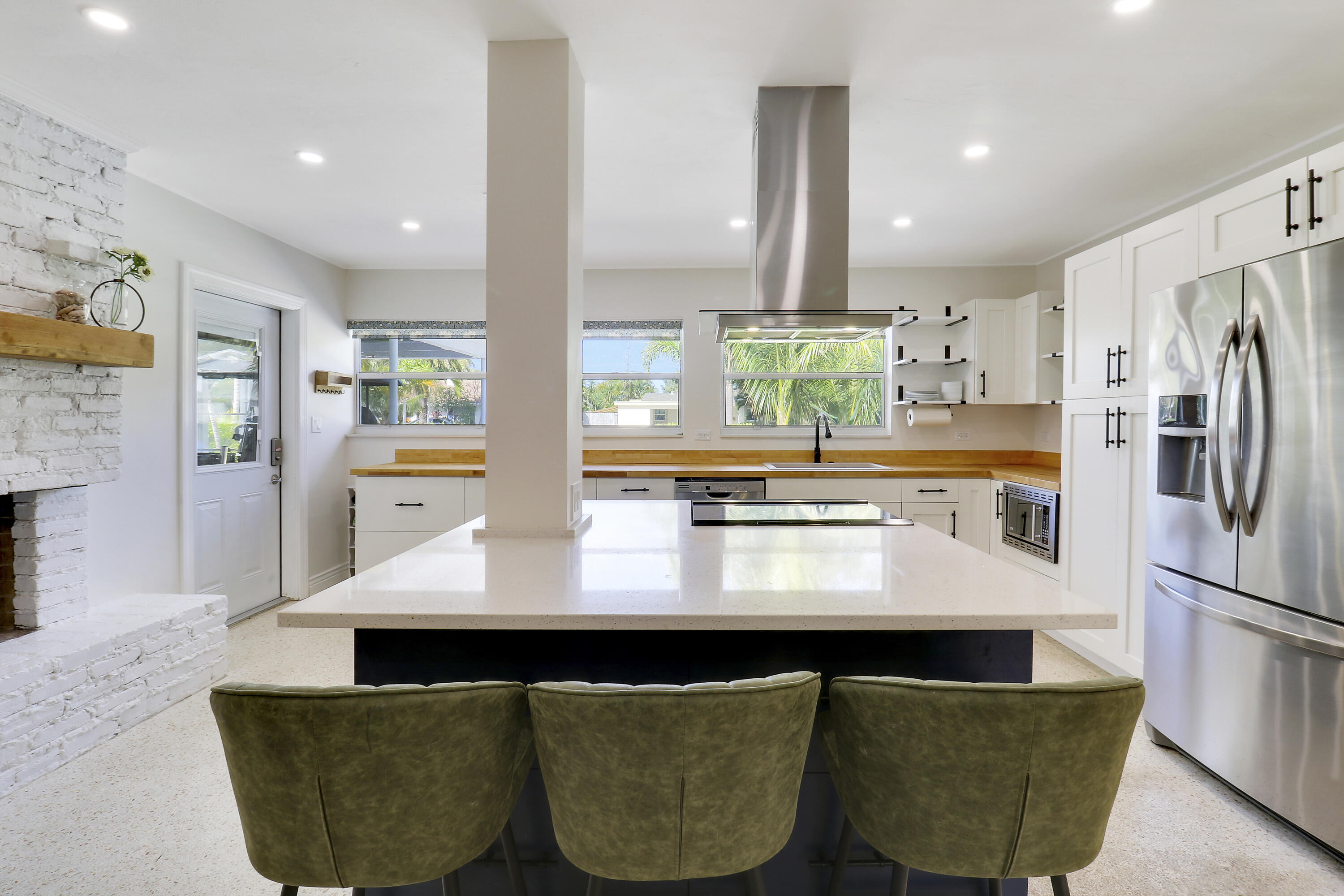 520 Inlet Road North Palm Beach, FL 33408 - Photo 33 of 51 a kitchen with kitchen island a refrigerator sink and stove