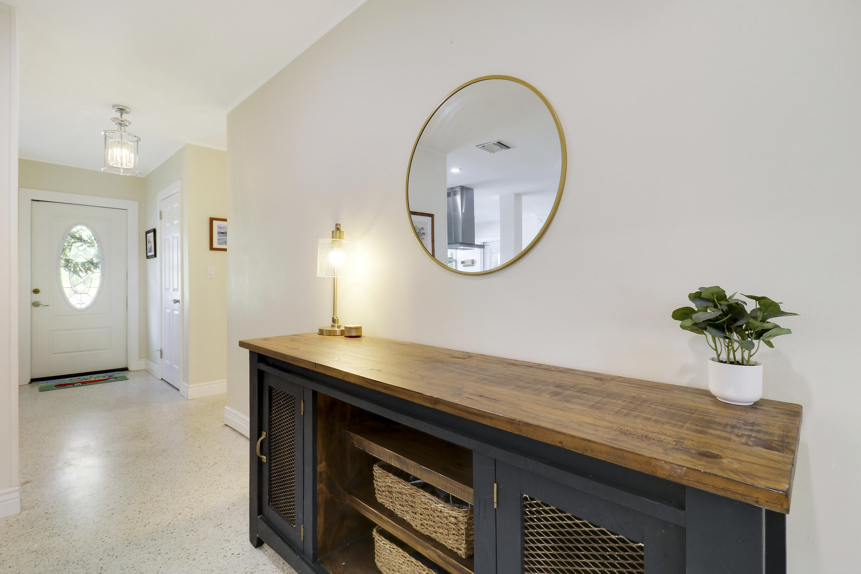 520 Inlet Road North Palm Beach, FL 33408 - Photo 40 of 51 an entryway with a table and a mirror