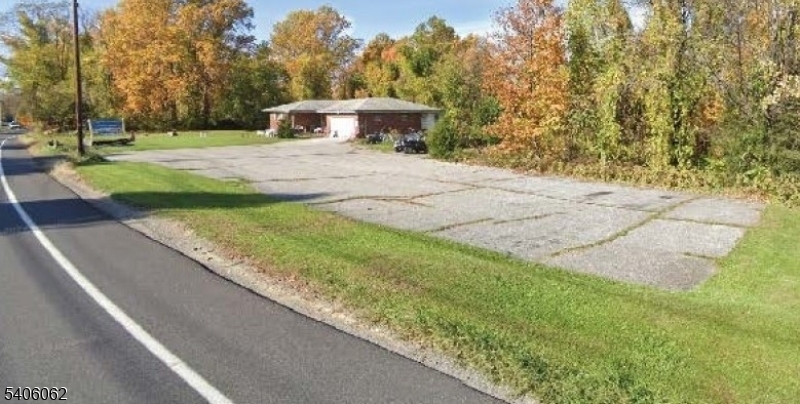 233 Highway 94 Vernon, NJ 07462 - Photo 4 of 5 a view of a house with a yard and large trees