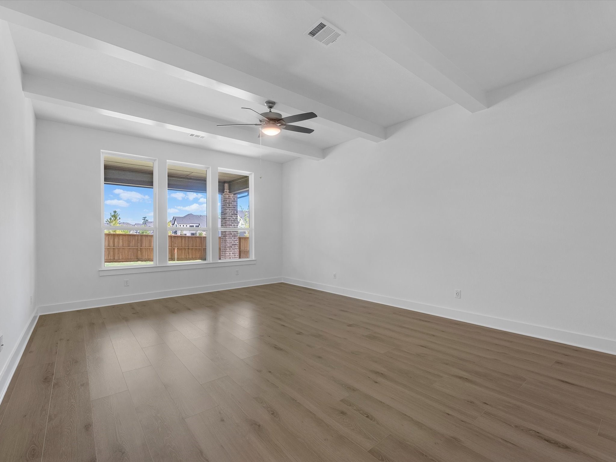 28117 Fox Bnd Drive Spring, TX 77386 - Photo 12 of 26 a view of an empty room with wooden floor and a window