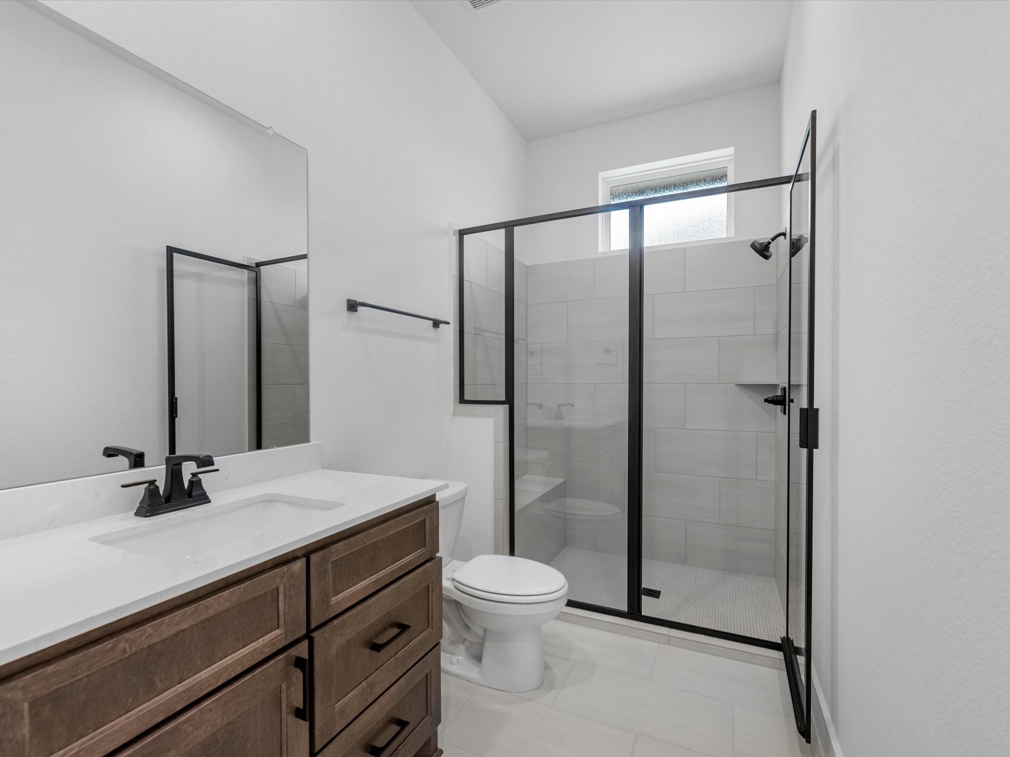 28117 Fox Bnd Drive Spring, TX 77386 - Photo 15 of 26 a bathroom with a shower sink mirror and toilet