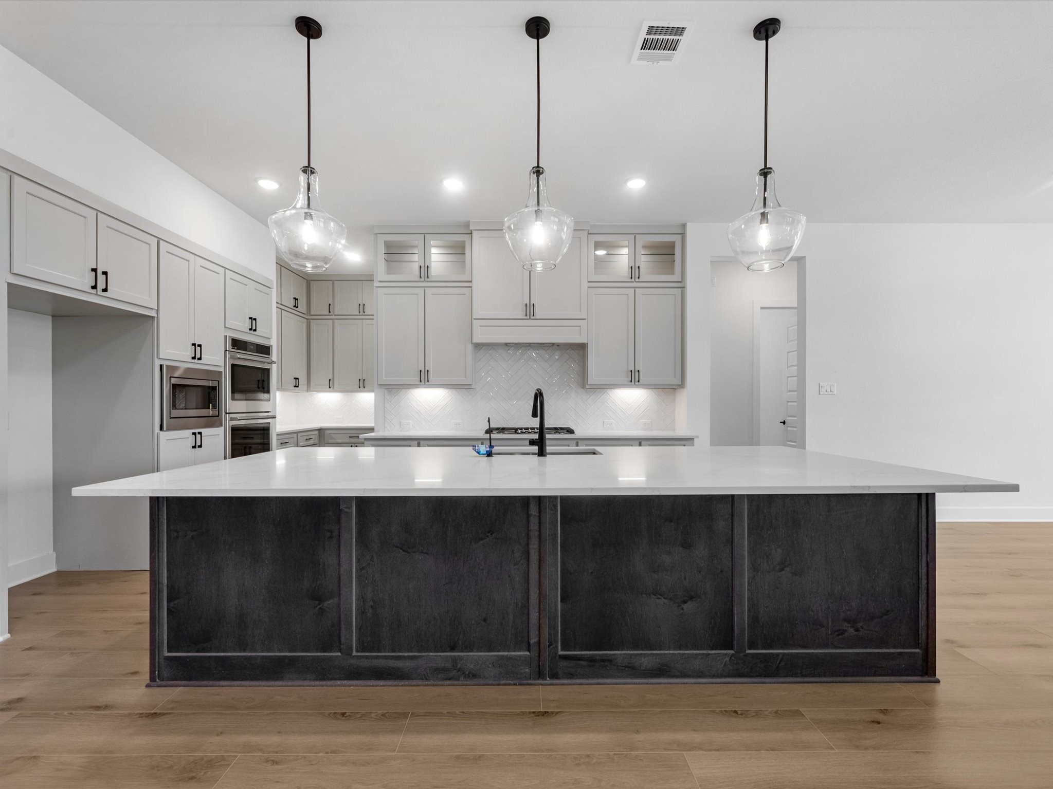 28117 Fox Bnd Drive Spring, TX 77386 - Photo 2 of 26 a view of a kitchen with kitchen island stainless steel appliances sink and wooden floor