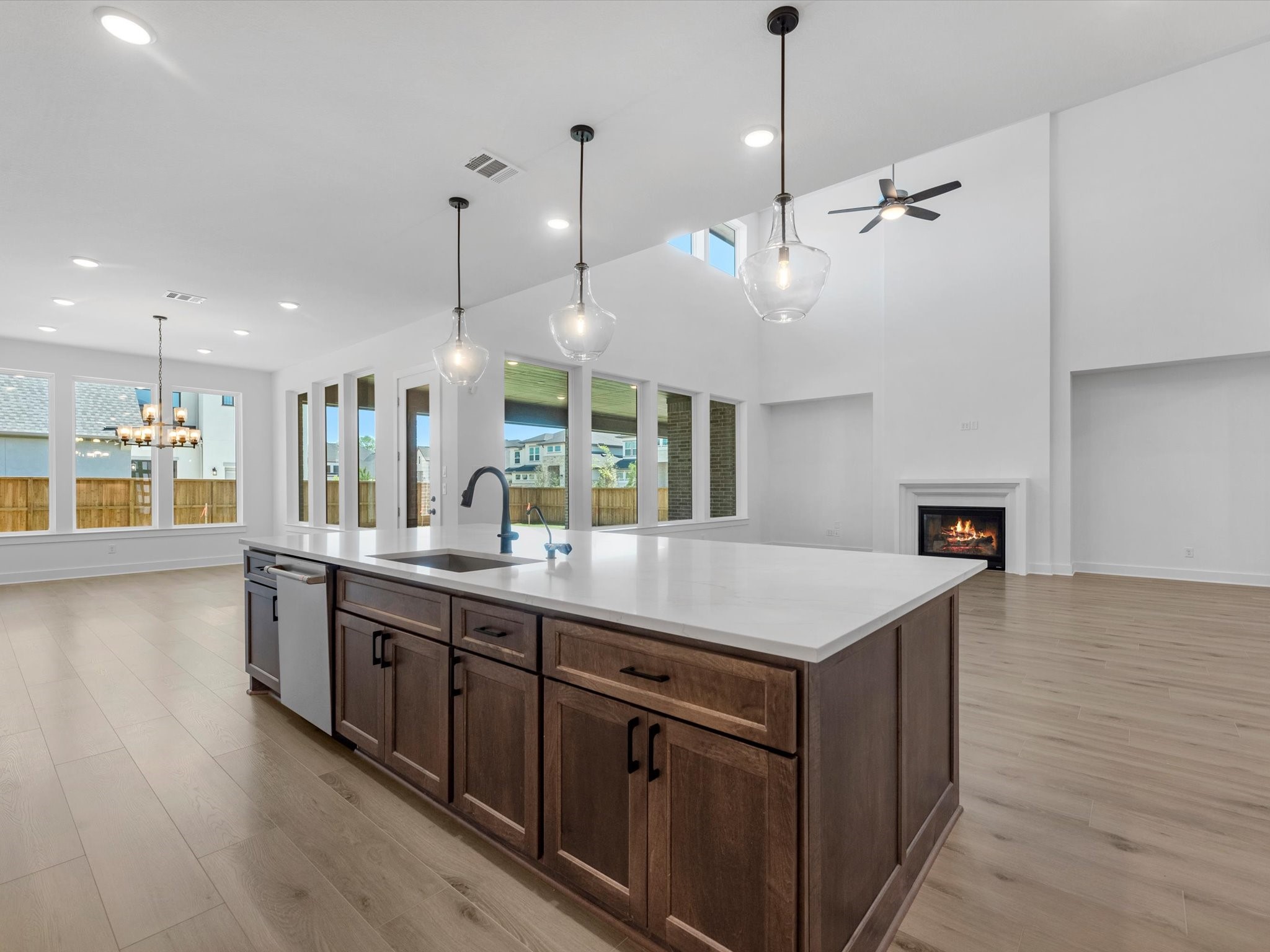 28117 Fox Bnd Drive Spring, TX 77386 - Photo 4 of 26 a kitchen with kitchen island a sink counter top space and a fireplace