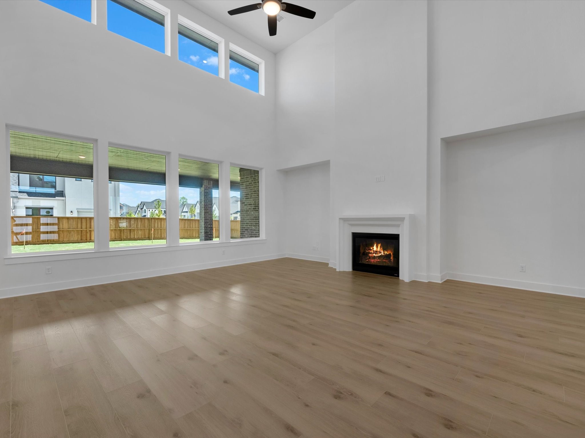 28117 Fox Bnd Drive Spring, TX 77386 - Photo 6 of 26 an empty room with wooden floor and fireplace