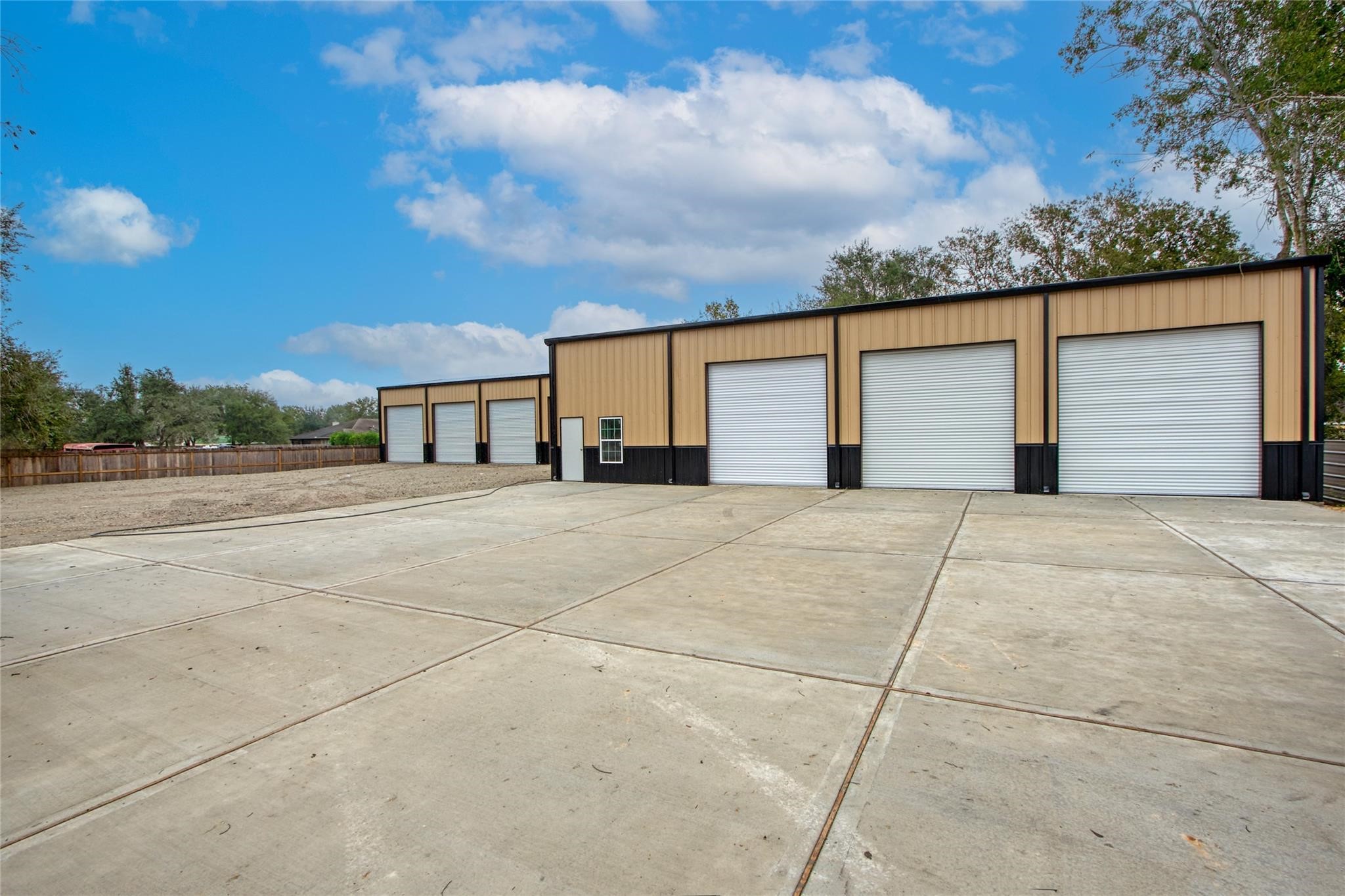 13051 Pleasant Valley Drive, Unit A Rosharon, TX 77583 - Photo 11 of 17 a front view of a house with a yard and garage