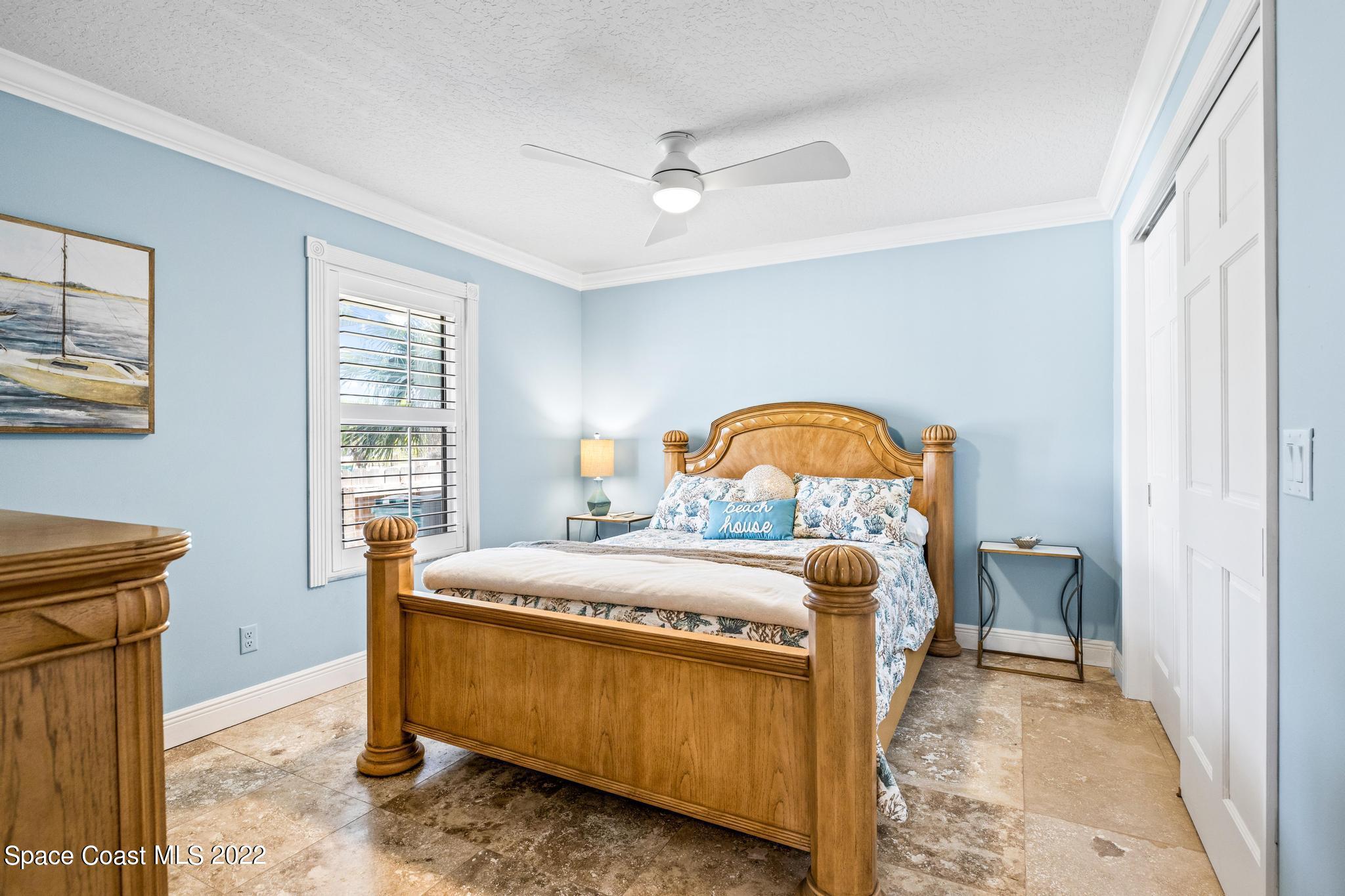 470 Veracruz Boulevard Indialantic, FL 32903 - Photo 13 of 25 a bedroom with a bed and a window