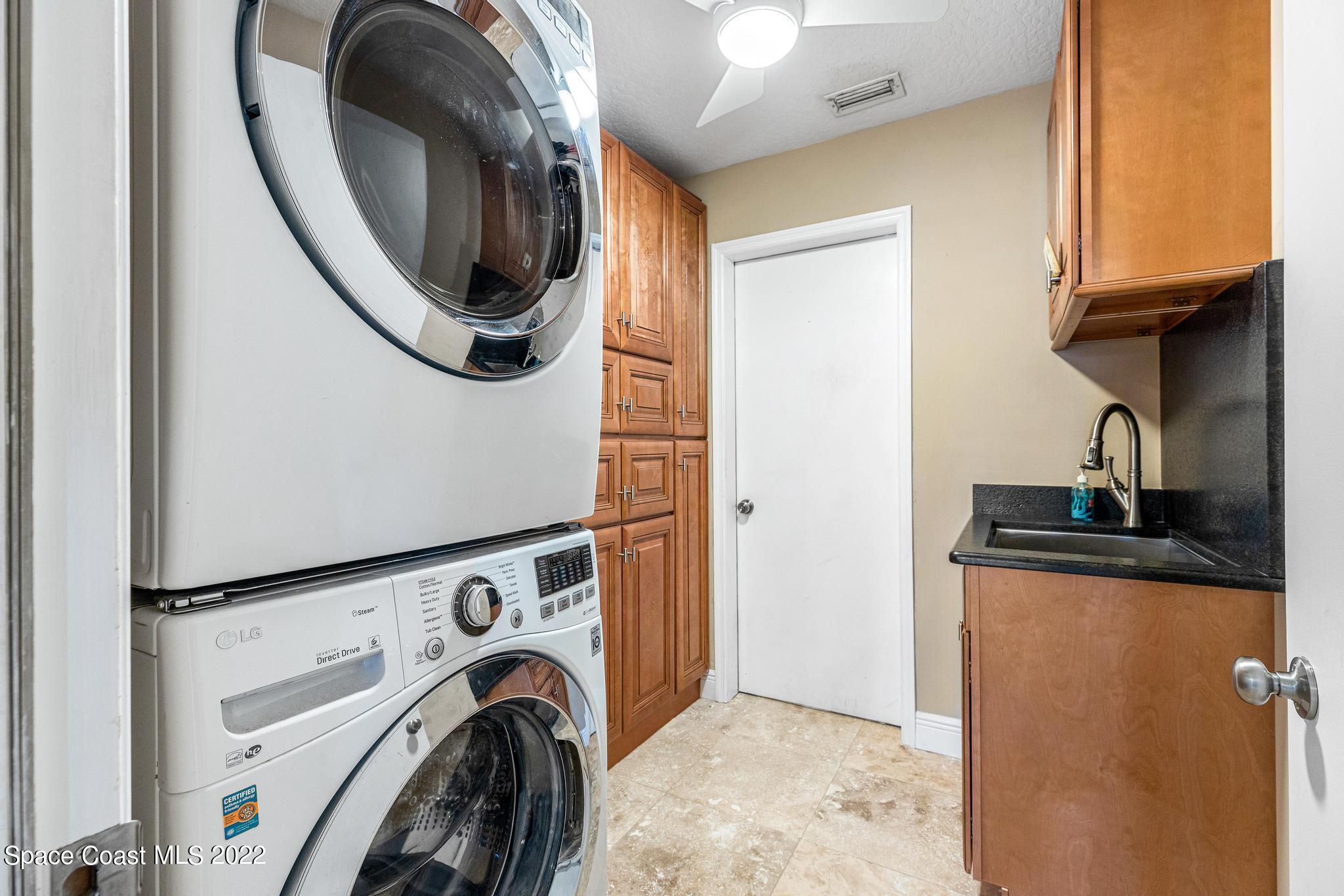 470 Veracruz Boulevard Indialantic, FL 32903 - Photo 14 of 25 a view of a storage and utility room with washer and dryer