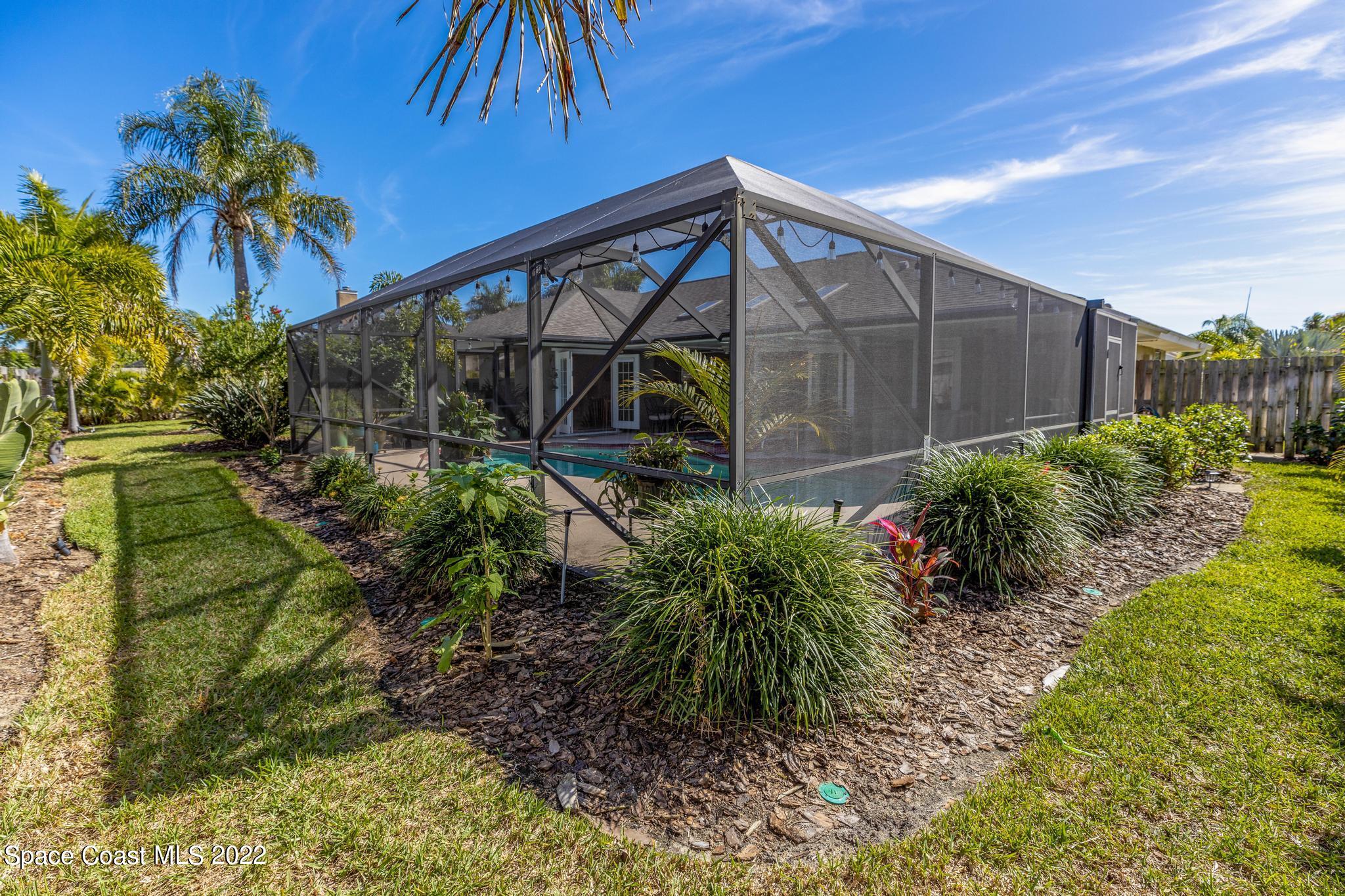470 Veracruz Boulevard Indialantic, FL 32903 - Photo 18 of 25 a backyard of a house with lots of green space