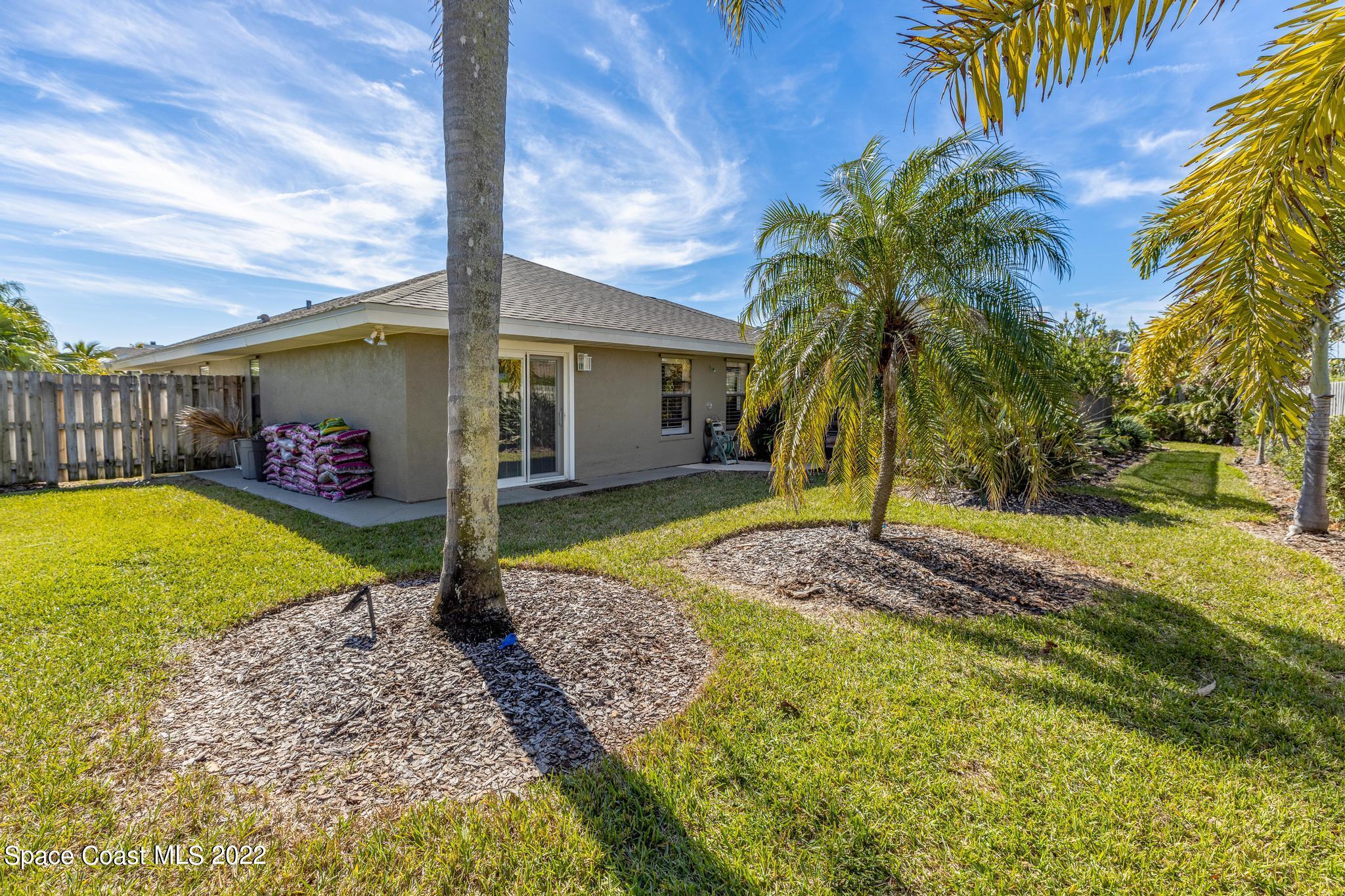 470 Veracruz Boulevard Indialantic, FL 32903 - Photo 19 of 25 a front view of a house with garden